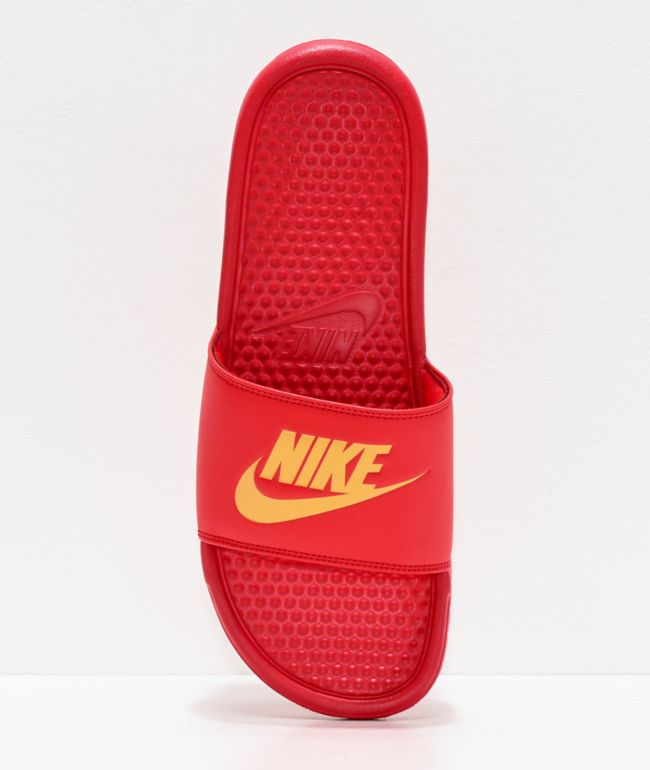 red nike slides with gold check